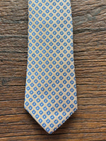 100% SILK CHAMPAGNE AND BLUE WOVEN NEATS TIE, THE LABEL