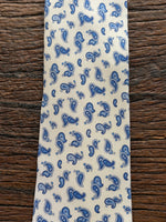 100% SILK WHITE AND BLUE PAISLEY PRINT TIE, THE LABEL
